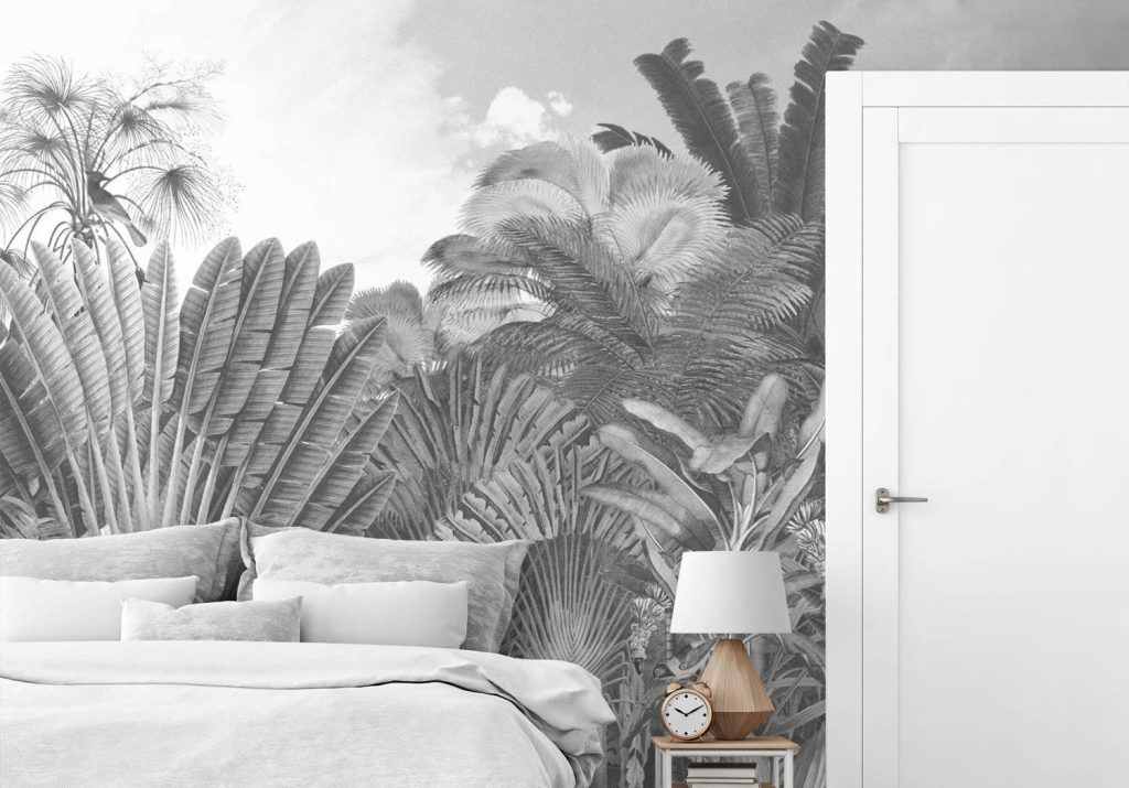Desain kamar tidur monokrom dengan mural hitam-putih dan tekstur dinding yang menambah kesan artistik.